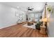 Spacious living room with wood flooring, modern decor, and bright, neutral walls at 5514 7Th N Ave, St Petersburg, FL 33710