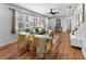 Bright living room with wood floors, a comfortable seating arrangement, and large window at 5514 7Th N Ave, St Petersburg, FL 33710