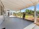 Covered patio with string lights overlooking the spacious backyard at 5514 7Th N Ave, St Petersburg, FL 33710