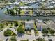 Aerial view of a waterfront community showcasing houses with docks and the surrounding network of canals at 5710 Tortoise Pl, Apollo Beach, FL 33572