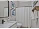 Bathroom featuring a glass-enclosed shower, modern vanity, and stylish decor at 5710 Tortoise Pl, Apollo Beach, FL 33572