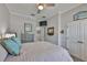 Bright bedroom featuring a queen-size bed, ceiling fan, and relaxing decor at 5710 Tortoise Pl, Apollo Beach, FL 33572