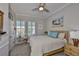 Cozy bedroom featuring a queen-size bed, neutral color palette, and ample natural light at 5710 Tortoise Pl, Apollo Beach, FL 33572