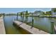 Private boat dock on the water with a boat lift, offering direct access to the water for boating at 5710 Tortoise Pl, Apollo Beach, FL 33572