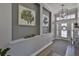 Charming entryway with decorative wall art, modern lighting, and stylish accents at 5710 Tortoise Pl, Apollo Beach, FL 33572