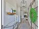 Elegant entryway with stylish decor, modern lighting, and beautiful wood-look flooring at 5710 Tortoise Pl, Apollo Beach, FL 33572