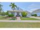 Charming single-Gathering home with a beautifully landscaped front yard and inviting curb appeal at 5710 Tortoise Pl, Apollo Beach, FL 33572