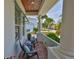 Cozy front porch with comfortable seating, perfect for relaxing and enjoying the outdoors at 5710 Tortoise Pl, Apollo Beach, FL 33572