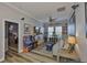 Entertainment room complete with TV, game consoles, sofa and ceiling fan at 5710 Tortoise Pl, Apollo Beach, FL 33572
