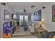 Entertainment room complete with TV, game consoles, sofa and ceiling fan at 5710 Tortoise Pl, Apollo Beach, FL 33572
