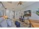 Cozy Gathering room featuring comfortable seating, arcade games, and hardwood floors at 5710 Tortoise Pl, Apollo Beach, FL 33572