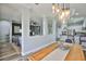View of the open concept floor plan, kitchen with island, living area, and gray accent walls at 5710 Tortoise Pl, Apollo Beach, FL 33572