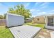 The backyard features a storage shed, a fire pit, and a small wood deck at 6012 Flora Ter, Apollo Beach, FL 33572