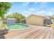 Backyard view featuring a pool, a storage shed, and the exterior of the house at 6012 Flora Ter, Apollo Beach, FL 33572