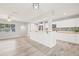Open floor plan with kitchen overlooking the living and dining areas at 6012 Flora Ter, Apollo Beach, FL 33572