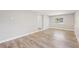 Open living room with gray walls, natural light and wood-look flooring at 6012 Flora Ter, Apollo Beach, FL 33572