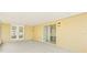 Covered patio featuring a light fixture and a pair of doors leading to the backyard at 6012 Flora Ter, Apollo Beach, FL 33572