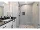 Bathroom featuring a glass shower with a niche and a modern sink and vanity at 604 Kinnear Dr, Brooksville, FL 34601