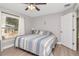 Bedroom features a large window for natural light and hardwood floors at 604 Kinnear Dr, Brooksville, FL 34601