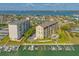 Beautiful waterfront condo complex featuring a pool, boat slips, and picturesque water views at 650 Island Way # 606, Clearwater Beach, FL 33767