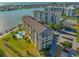 Aerial view of bayfront condos featuring a pool, and boat docks at 650 Island Way # 606, Clearwater Beach, FL 33767
