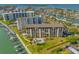 Enjoy waterfront living with a pool, boat slips, and beautiful landscaping at this condo complex at 650 Island Way # 606, Clearwater Beach, FL 33767