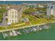 Aerial view of waterfront condos with boat slips ready for endless nautical adventures at 650 Island Way # 606, Clearwater Beach, FL 33767