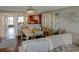 Spacious dining room with a glass table and seating for four, with easy access to living room at 650 Island Way # 606, Clearwater Beach, FL 33767