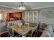 Dining area with a glass table and seating for four with easy access to the kitchen at 650 Island Way # 606, Clearwater Beach, FL 33767