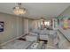 Living room features hardwood floors, crystal chandeliers and views of the dining area at 650 Island Way # 606, Clearwater Beach, FL 33767