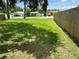 Fenced-in backyard with lush lawn and privacy fencing offers outdoor space at 7651 46Th N Way, Pinellas Park, FL 33781