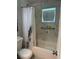 Bathroom featuring a shower/tub combo with grab bar and white marble-look tile at 7651 46Th N Way, Pinellas Park, FL 33781