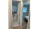 A bathroom with a shower and door leading to bedroom at 7651 46Th N Way, Pinellas Park, FL 33781