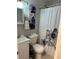 Cozy bathroom with a white vanity and coordinating shower curtain at 7651 46Th N Way, Pinellas Park, FL 33781