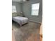 Bedroom featuring carpet flooring, a lamp, and natural light from the window at 7651 46Th N Way, Pinellas Park, FL 33781
