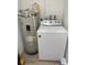 The laundry area includes a water heater, and washing machine at 7651 46Th N Way, Pinellas Park, FL 33781