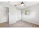 Bedroom featuring wood-look flooring, a ceiling fan, and closet at 7891 67Th N St, Pinellas Park, FL 33781