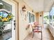 Inviting front porch with seating area and stylish decor creates a welcoming outdoor space at 8110 Damara Dr, New Port Richey, FL 34653
