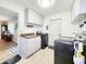 Well-organized laundry room with modern appliances, ample cabinet space, and neutral colors, perfect for efficient chores at 8110 Damara Dr, New Port Richey, FL 34653