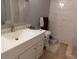 Bathroom featuring updated fixtures, sink with cabinet, and tiled shower at 9100 Dr Martin Luther King Jr N St # 303, St Petersburg, FL 33702