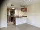 A compact kitchen features stainless steel appliances and light brown cabinets at 9100 Dr Martin Luther King Jr N St # 303, St Petersburg, FL 33702