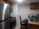 The kitchen has stainless steel appliances, granite countertops, and a breakfast bar at 9100 Dr Martin Luther King Jr N St # 303, St Petersburg, FL 33702