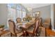 Formal dining room featuring a chandelier, large windows, and elegant furniture at 9220 Hidden Water Cir, Riverview, FL 33578