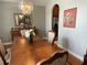 Dining room featuring chandelier, buffet table, and a wood table with seating for four at 9220 Hidden Water Cir, Riverview, FL 33578