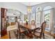 Bright dining room with large windows, chandelier, and elegant table set at 9220 Hidden Water Cir, Riverview, FL 33578
