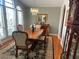 Formal dining room with a chandelier, a large table, and a decorative rug at 9220 Hidden Water Cir, Riverview, FL 33578