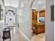 Grand foyer with views of the kitchen, hardwood floors, tile accents, and an ornate front door at 9220 Hidden Water Cir, Riverview, FL 33578
