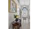 Elegant foyer with a chandelier, tiled floor, and decorative table, creating a welcoming entrance to the home at 9220 Hidden Water Cir, Riverview, FL 33578