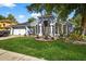 Charming home with a lush front yard, decorative landscaping and a two-car garage at 9220 Hidden Water Cir, Riverview, FL 33578