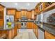 Spacious kitchen with stainless steel appliances, granite countertops, and ample storage at 9220 Hidden Water Cir, Riverview, FL 33578